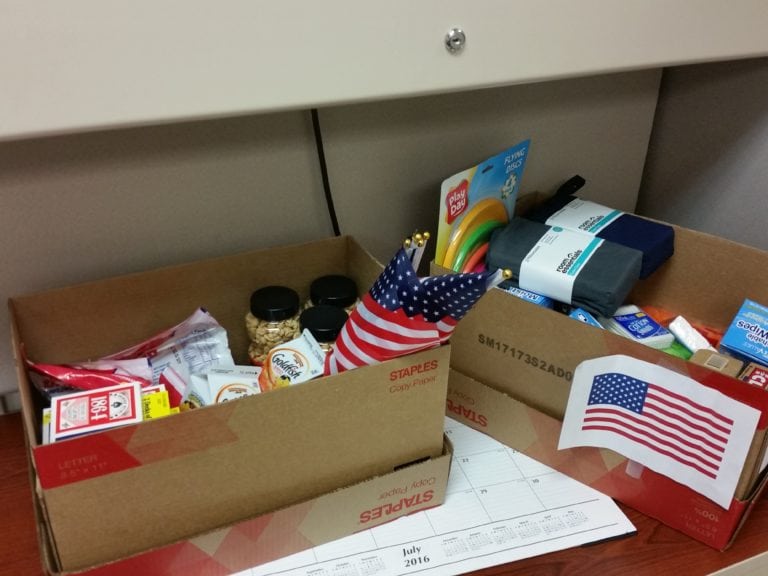 Local Law Firm Prepares Care Packages for Troops