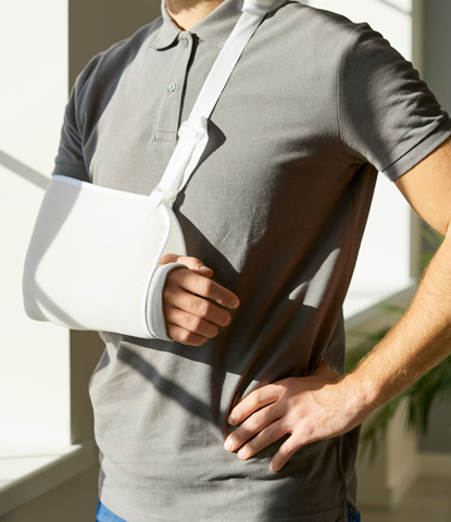 injured man who wearing medical support brace and sling bandage immobilizer on his arm