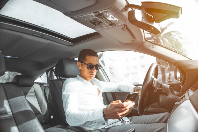 person texting while driving