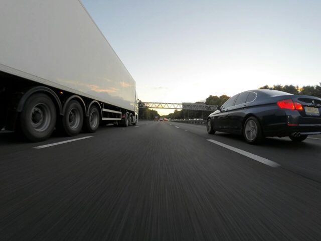 truck and car on road