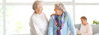 Happy senior women in nursing home cropped